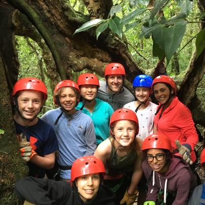 Middle school students take a group photo before they go zip lining in Costa Rica Projects Abroad volunteer prepare for their ziplining experience through the Costa Rican forest